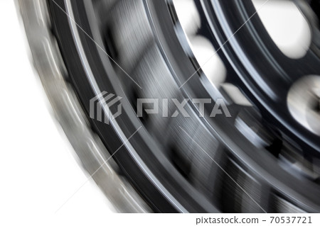 The drive gear of bicycle is quickly rotated on a white background.Chain to drive gear wheel to bike 70537721