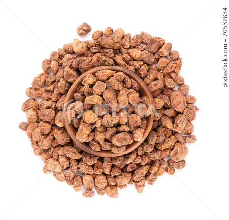 Tigernuts isolated on white background. Chufa nuts or tiger nuts in wooden bowl. Top view. Tigernuts isolated on white background. Chufa nuts or tiger nuts in wooden bowl. Top view. 70537834