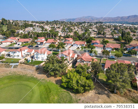 Aerial view of Southern California houses surrounded by golf in inland town Corona 70538351