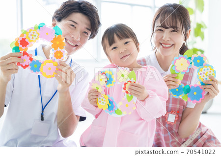 Childcare image: A girl and a childcare worker who work Childcare image: A girl and a childcare worker who work 70541022