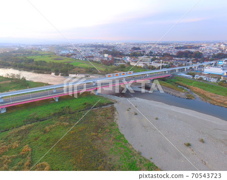 Tama City Monorail passing through Tappi Bridge-Aerial view by drone (Hino City, Tokyo) Tama City Monorail passing through Tappi Bridge-Aerial view by drone (Hino City, Tokyo) 70543723