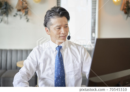 Male business having an online meeting Male business having an online meeting 70545310