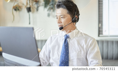 Male business having an online meeting Male business having an online meeting 70545311