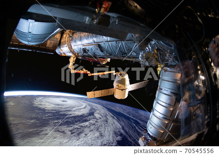 Planet Earth and hurricane from the outer space from the space station porthole.  70545556