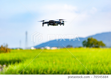 Rice fields, mountains, sky, original scenery of Japan taken with a drone Rice fields, mountains, sky, original scenery of Japan taken with a drone 70545884