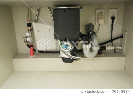 The front of the disposer (garbage crusher) under the sink 70545984