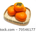 Persimmons in a basket Persimmons in a bamboo colander 70546177