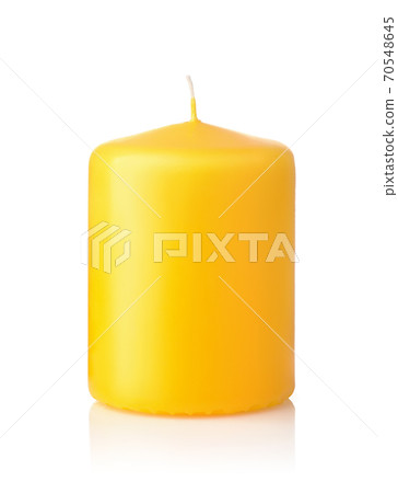 Front view of yellow unused wax candle Front view of yellow unused wax candle 70548645