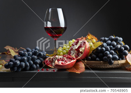 Ripe juicy grape and glass of wine 70548905