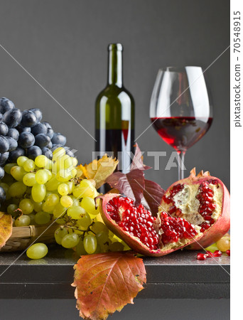 Ripe juicy grape and glass of wine 70548915