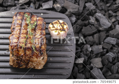 Grilled beef steaks with spices grilled. Grilled beef steaks with spices grilled. 70549075