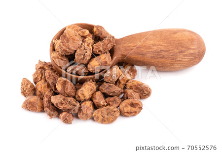 Tigernuts isolated on white background. Chufa nuts or tiger nuts in wooden spoon. 70552576