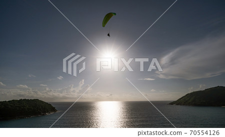 Paraglider extreme sports in summer day phuket thailand. Paraglider extreme sports in summer day phuket thailand. 70554126