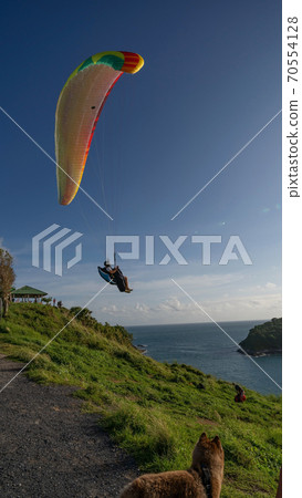 Paraglider extreme sports in summer day phuket thailand. Paraglider extreme sports in summer day phuket thailand. 70554128