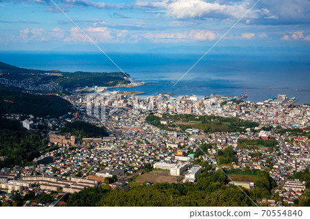 Ishikari Bay and the blue sky in the background in the city of Otaru seen from the observation deck of Mt. Tengu Ishikari Bay and the blue sky in the background in the city of Otaru seen from the observation deck of Mt. Tengu 70554840