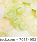 Long onion with a cross section of the heart 70554952