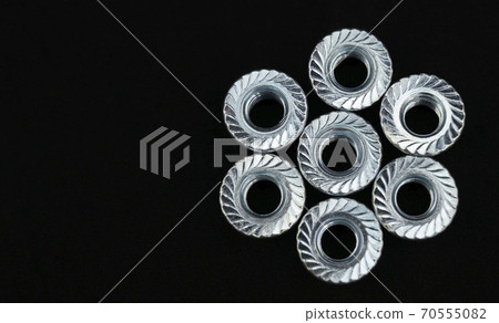 Nuts arranged in star on black background Nuts arranged in star on black background 70555082