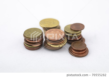 Euro coins piled up in columns Euro coins piled up in columns 70555282