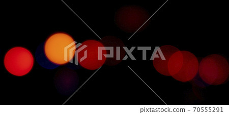 Flashes of orange and red lights on black background Flashes of orange and red lights on black background 70555291