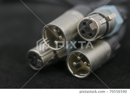 Canon or xlr type male and female connectors in the foreground Canon or xlr type male and female connectors in the foreground 70556590