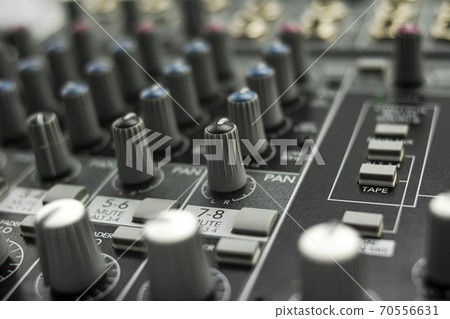 Inputs, equalization and panning on an analog mixing console 70556631
