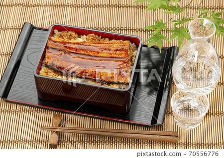 Unadon, sake and blue maple placed on a bamboo mat Unadon, sake and blue maple placed on a bamboo mat 70556776