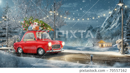 Santa claus in Cute little retro car with decorated christmas tree on top goes by wonderful countryside road. 70557162