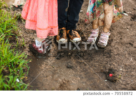 dirty shoes. goes in road after rain.  70558972