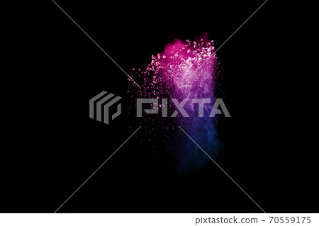 Freeze motion of colorful dust particles splash. Painted Holi powder. Freeze motion of colorful dust particles splash. Painted Holi powder. 70559175