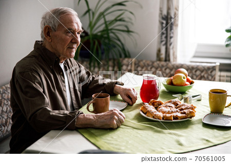 Aged man drinking tasty tea 70561005