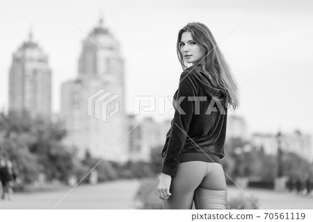 Portrait of a beautiful young sporty brunette girl. Black and white photo. BW 70561119