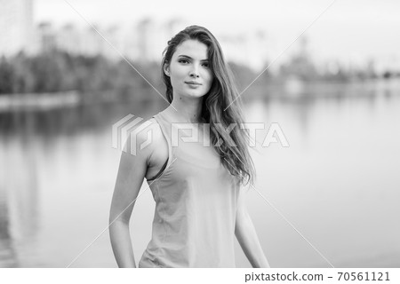 Portrait of a beautiful young sporty brunette girl. Black and white photo. BW 70561121