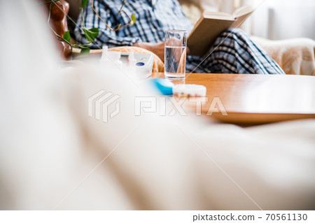 Old man sitting on armchair Old man sitting on armchair 70561130