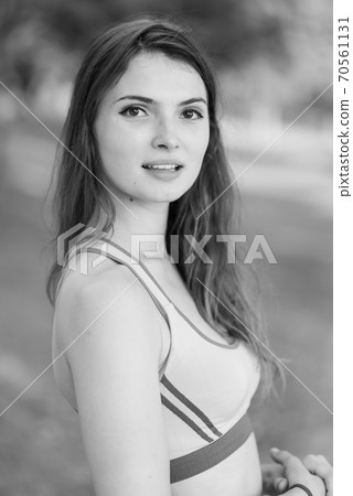 Portrait of a beautiful young sporty brunette girl. Black and white photo. BW 70561131