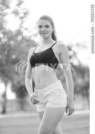 Portrait of a beautiful young sporty brunette girl. Black and white photo. BW Portrait of a beautiful young sporty brunette girl. Black and white photo. BW 70561156