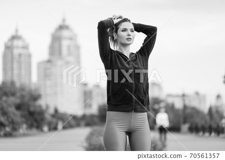 Portrait of a beautiful young sporty brunette girl. Black and white photo. BW 70561357