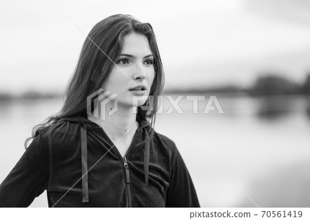 Portrait of a beautiful young sporty brunette girl. Black and white photo. BW Portrait of a beautiful young sporty brunette girl. Black and white photo. BW 70561419