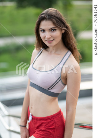 Portrait of a beautiful young sporty brunette girl 70561541