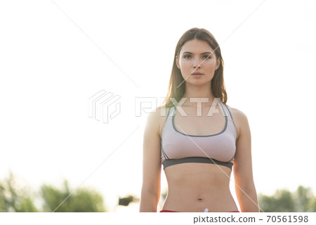 Portrait of a beautiful young sporty brunette girl 70561598