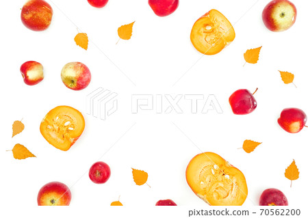 Autumnal frame composition. Fall leaves with apple and sliced pumpkin on white background Autumnal frame composition. Fall leaves with apple and sliced pumpkin on white background 70562200