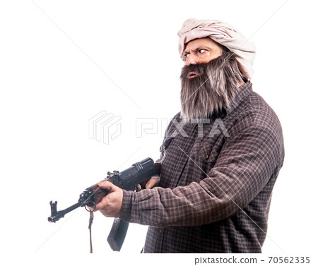 The bearded man armed with kalashnikov isolated on a white background.  70562335