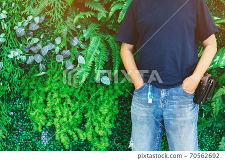 Mini portable alcohol gel bottle to kill Corona Virus(Covid-19) hanging on belt loop of man' s jeans with plants background. New normal lifestyle. Health care concept. Selective focus on alcohol gel Mini portable alcohol gel bottle to kill Corona Virus(Covid-19) hanging on belt loop of man' s jeans with plants background. New normal lifestyle. Health care concept. Selective focus on alcohol gel 70562692