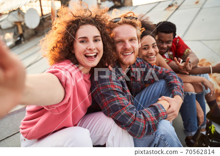 Happy friends spendingh good time on roof Happy friends spendingh good time on roof 70562814