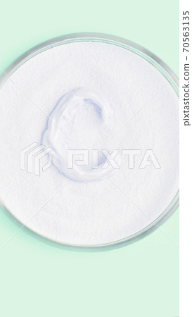 Collagen white powder. Pastel color background. Health product Collagen white powder. Pastel color background. Health product 70563135