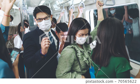 Sick man on train cough and make other people feel worry about virus spreading Sick man on train cough and make other people feel worry about virus spreading 70565622
