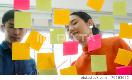 Business people work on project planning board Business people work on project planning board 70565655
