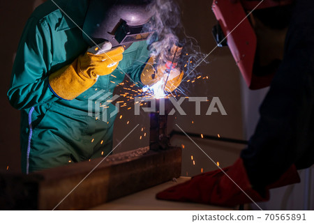 Metal welding steel works using electric arc welding machine 70565891