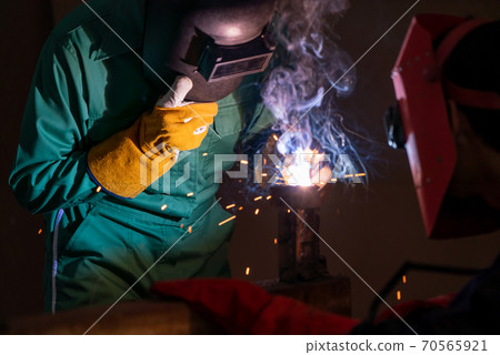 Metal welding steel works using electric arc welding machine Metal welding steel works using electric arc welding machine 70565921