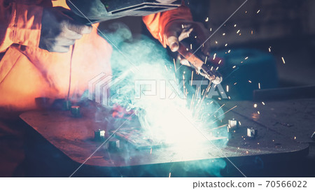 Metal welder working with arc welding machine 70566022