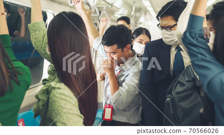Sick man on train cough and make other people feel worry about virus spreading 70566026